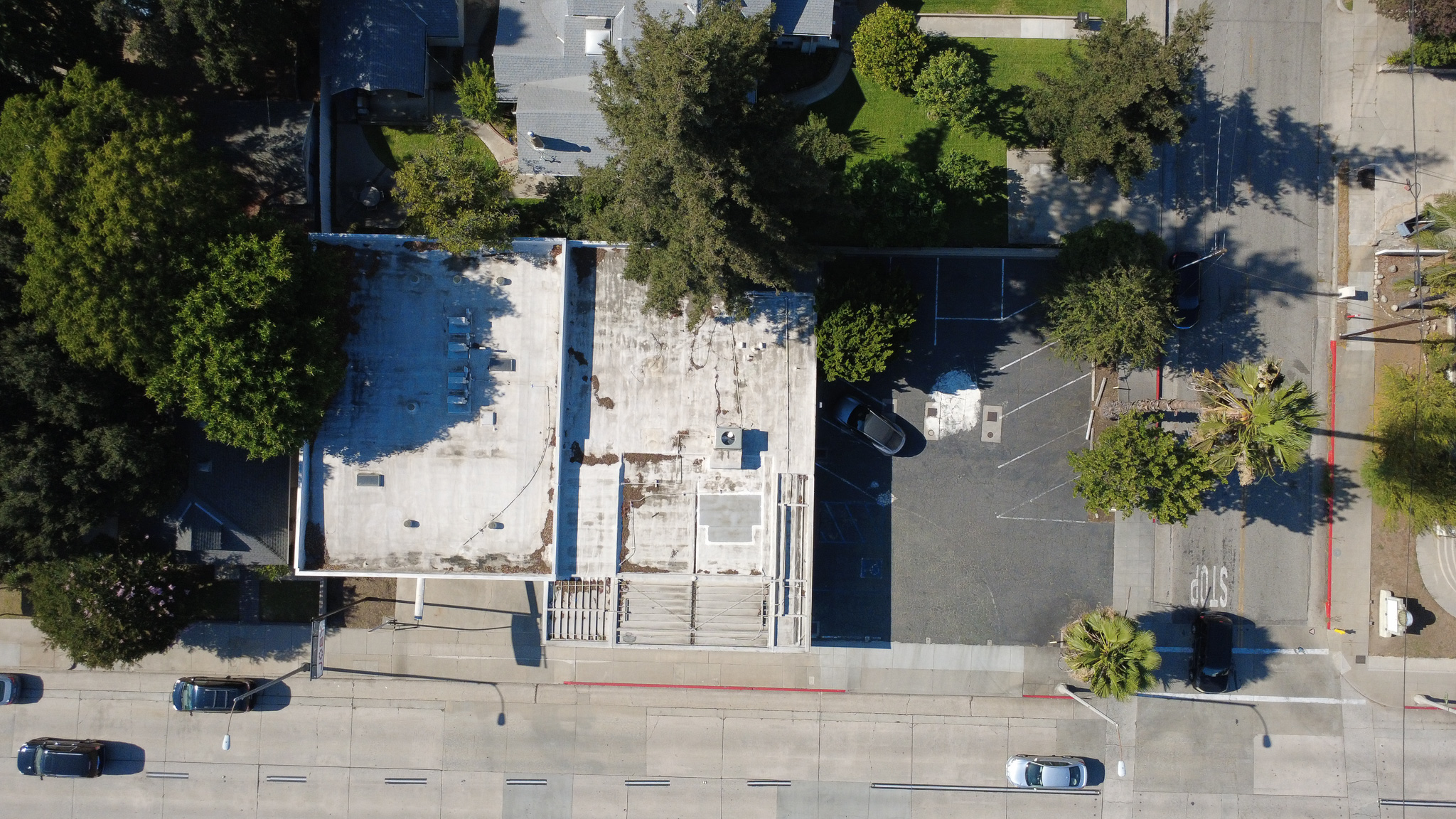 Top-down aerial of the site and parking